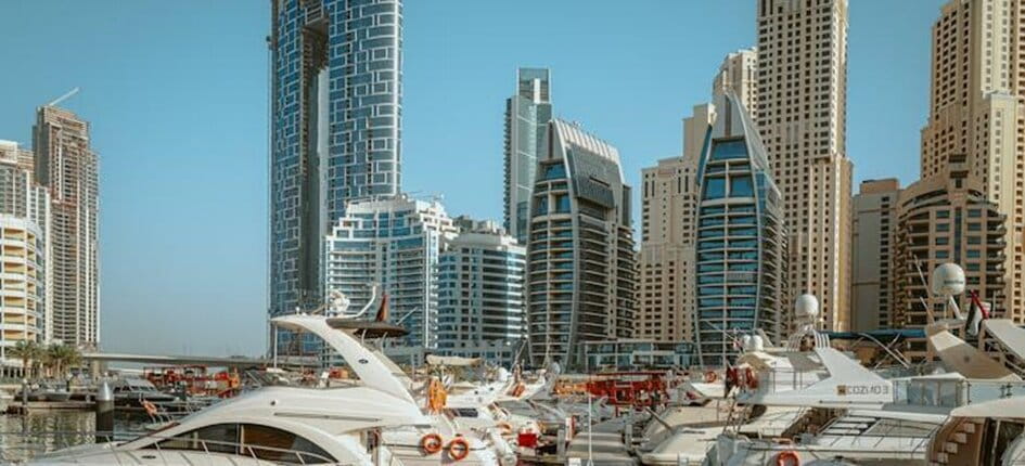 Dubai Marina skyline and yachts beside the promenade
